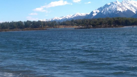The snow capped mountains behind Lake Fagnano