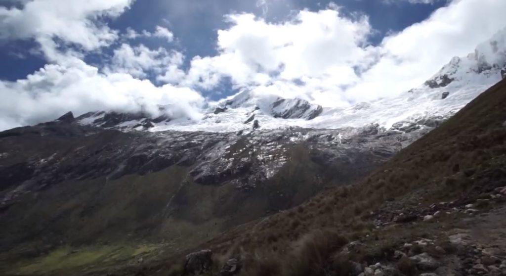 The snow-covered peaks line the valleys below