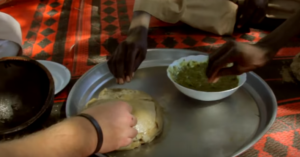 The dough is eaten with a sauce of okra paste