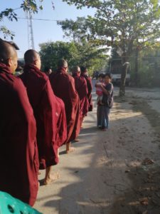 Monks getting donations of the local community (Alms)